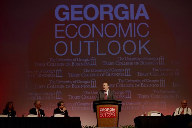 Terry College Dean Benjamin C. Ayers speaks to a large audience during a Georgia Economic Outlook event.