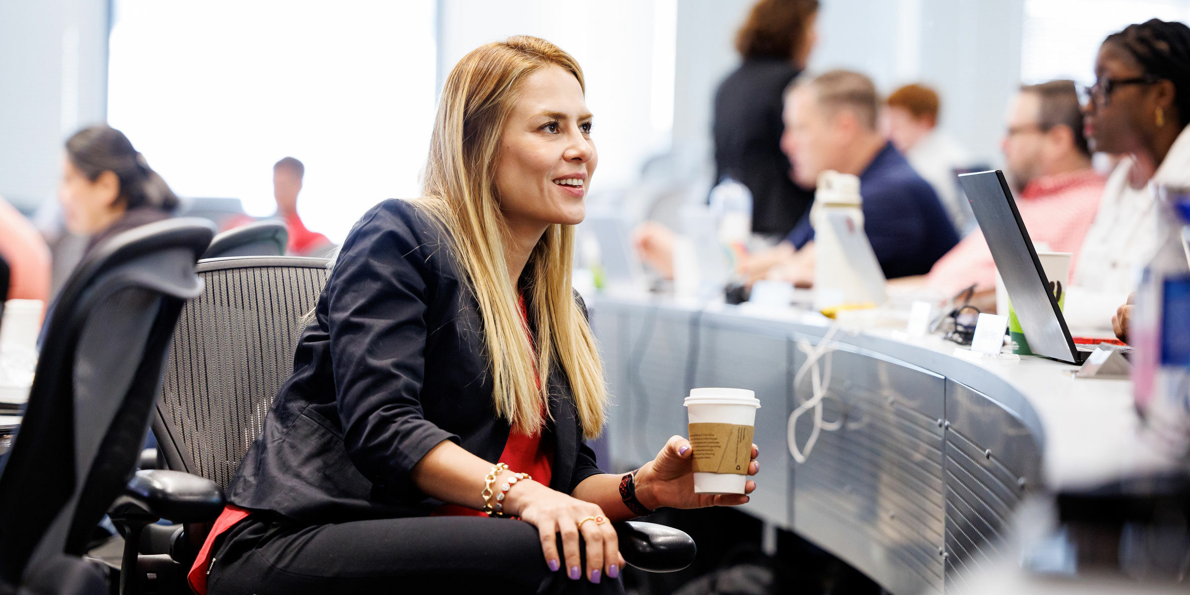 female EMBA student with coffee