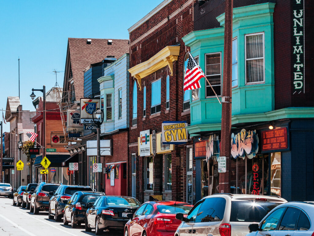 Scene of an aging small town neighborhood with storefronts