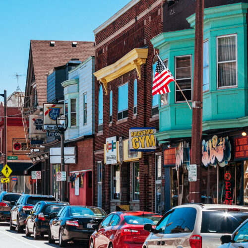 Scene of an aging small town neighborhood with storefronts
