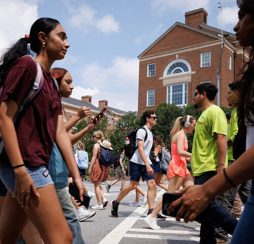 Students cross a busy crosswalk a the University of Georgia on the first day of classes.