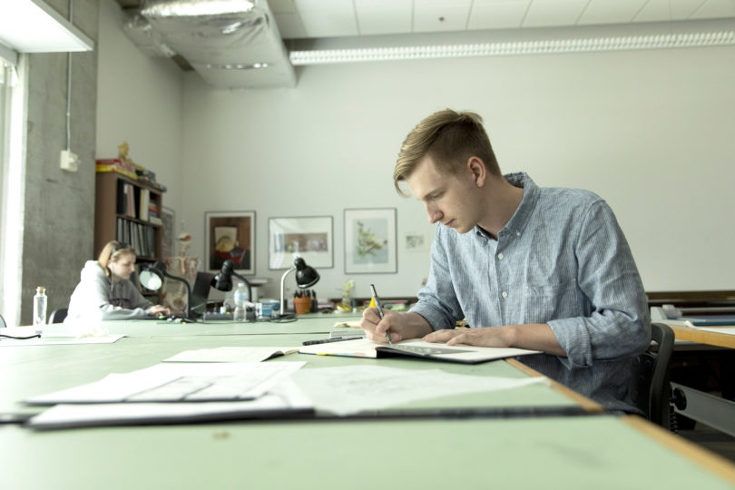 Jackson Mitchell completes coursework during an interior design class in the Lamar Dodd School of Art (Photo by Andrew Davis Tucker/UGA).