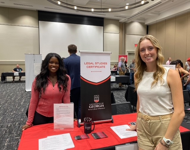 legal studies students at table during fair