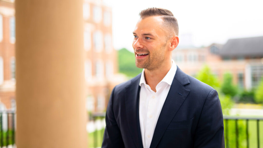 Morgan Moore against a background of Ivester Hall, Coca-Cola Plaza, and Bolton Dining
