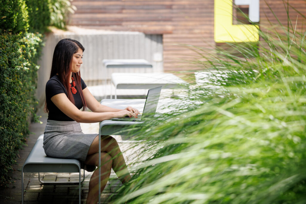 female working at outdoor table