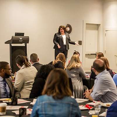 pmba-career Woman speaking to an audience