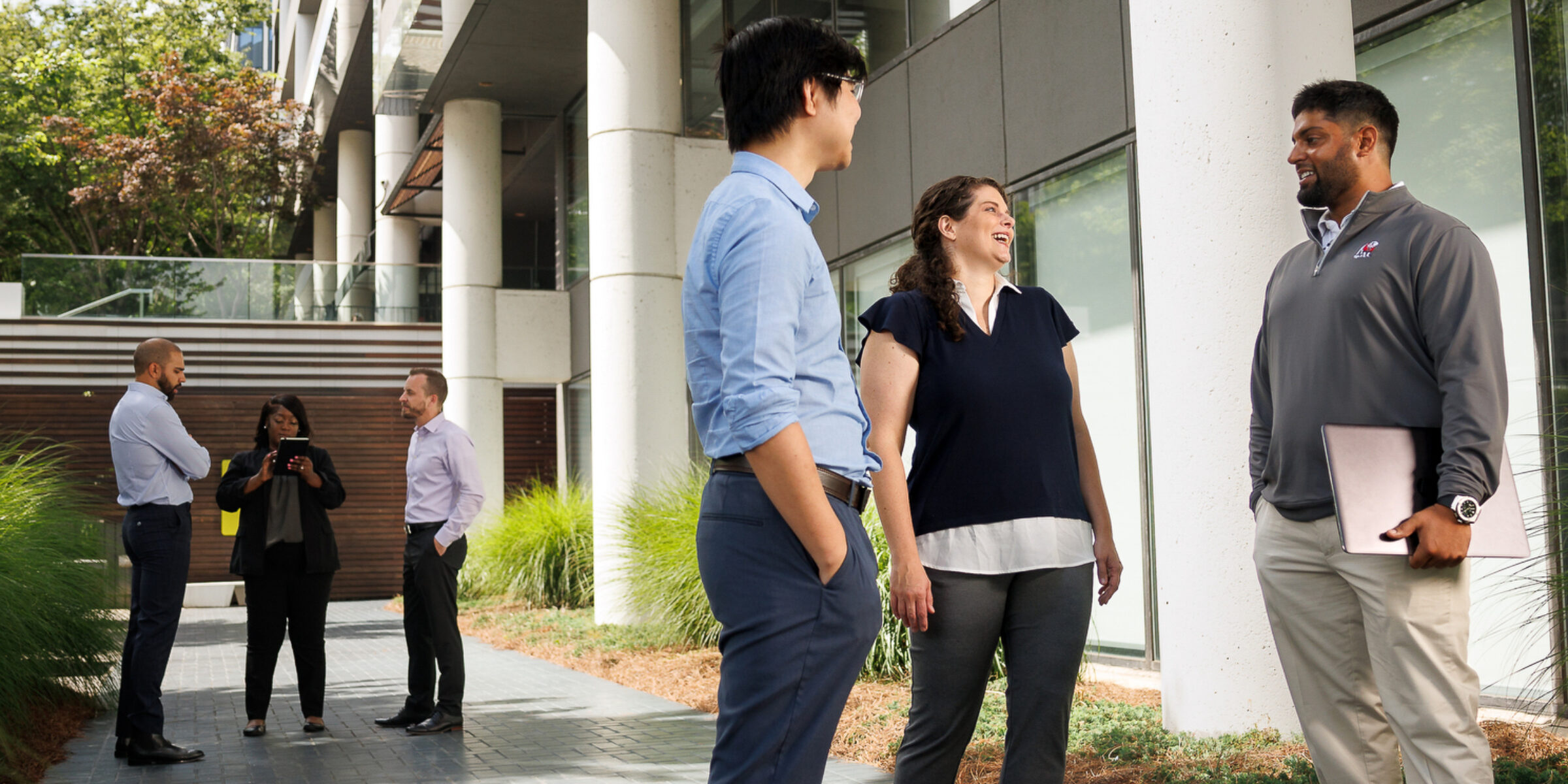 Student talking outside the Atlanta campus building.