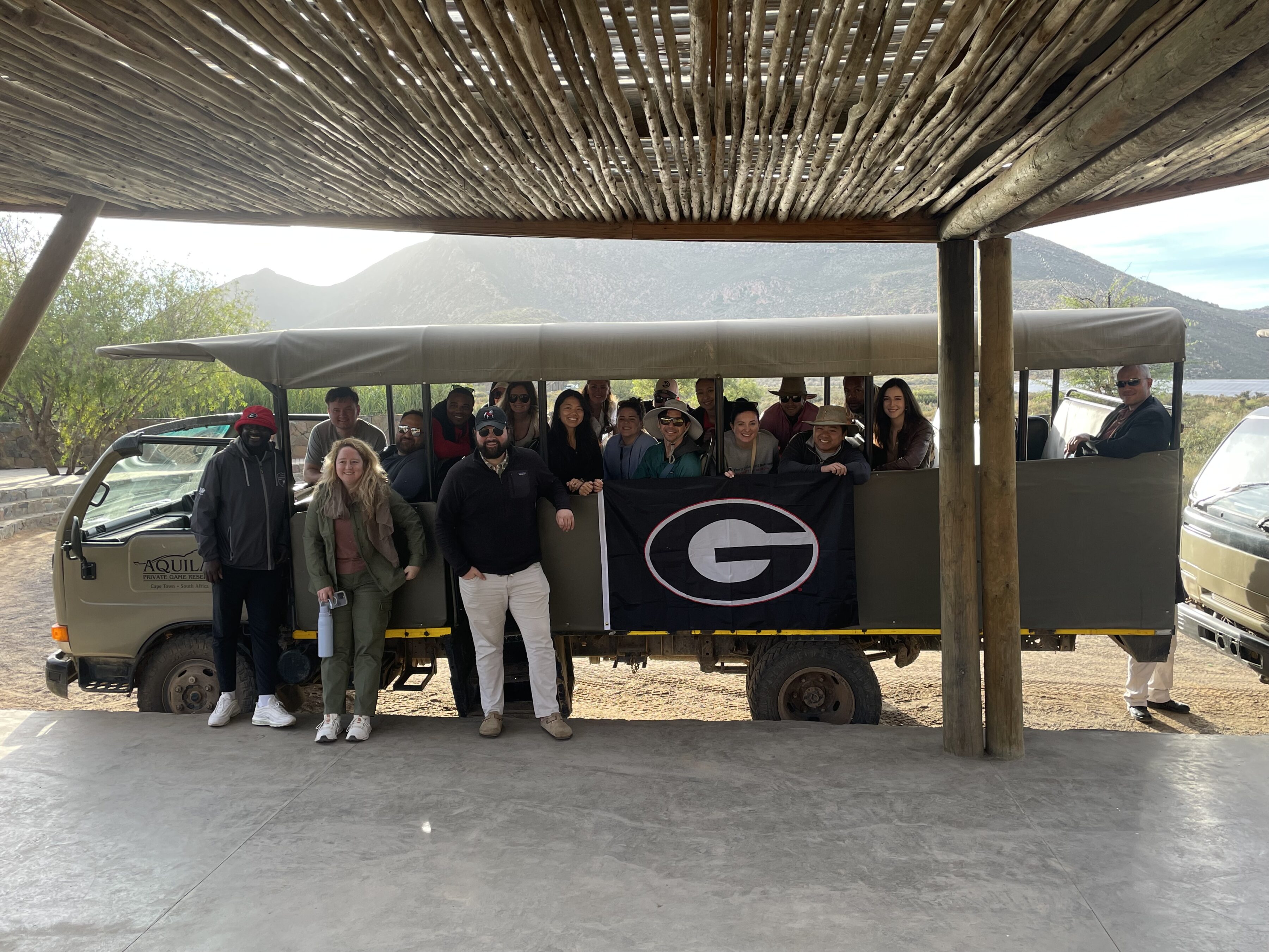Terry College MBA students poses for a photo from a tour bus during their visit to South Africa.