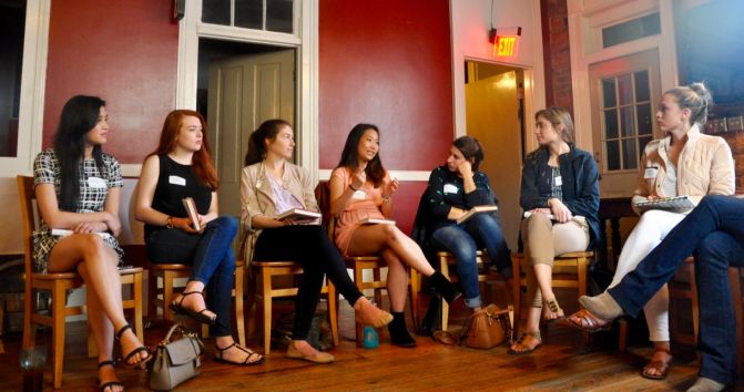 A group of UGA women discuss The Confidence Code by Claire Shipman and Katty Kay at a Terry Women's Initiative event. The women are