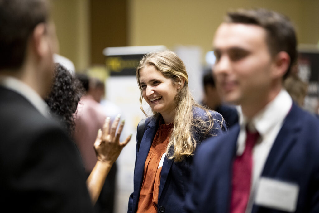 A woman laughs during a conversation at a Terry career fair