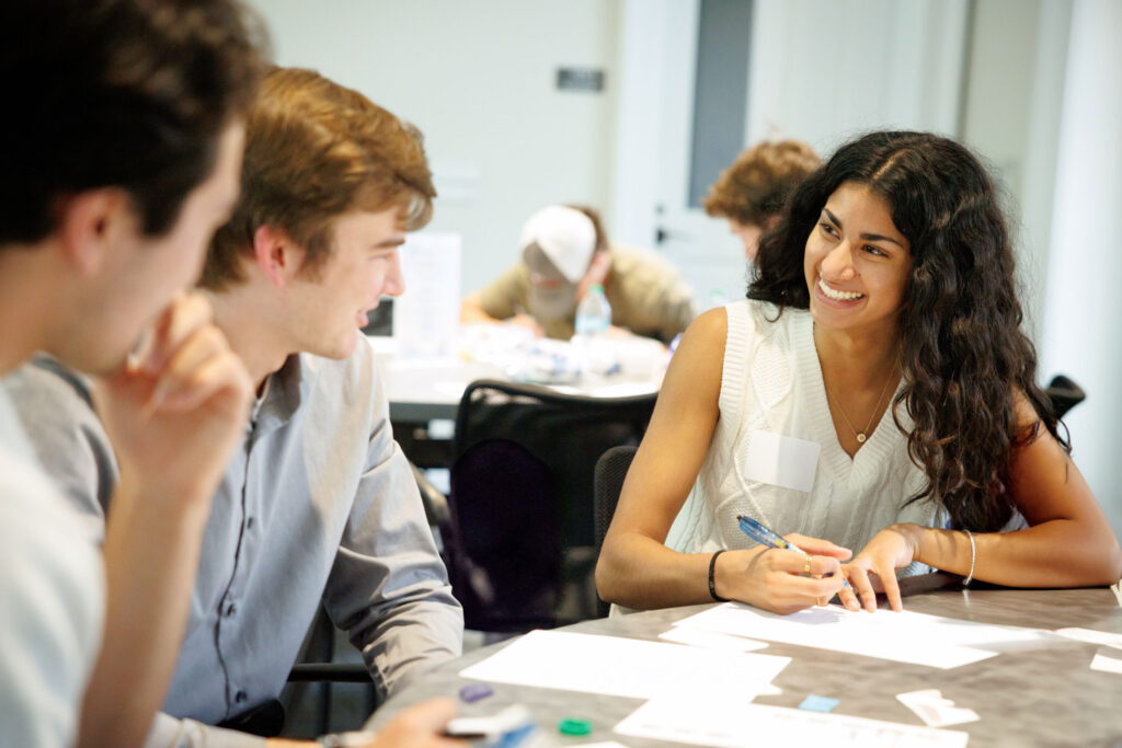 three undergraduate students at tabletop workshop